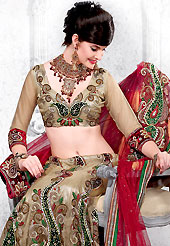 Take a look on the changing fashion of the season. This dark beige and red net lehenga choli is nicely embroidered and patch work done with resham, sequins, applique and stone work in form of floral and paisley motifs. All over embroidery work on lehenga is stunning. The beautiful embroidery on lehenga made it awesome and gives you stylish and attractive look to others. Matching choli and red net dupatta is availble with this lehenga. Slight Color variations are possible due to differing screen and photograph resolutions.