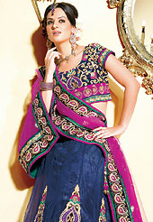 It’s cool and has a very modern look to impress all. This deep blue net lehenga choli is nicely embroidered and velvet patch border is done with zari, sequins and stone work. The beautiful embroidery on lehenga made it awesome and gives you stylish and attractive look to others. Matching net choli and contrasting magenta net dupatta is availble with this lehenga. Slight Color variations are possible due to differing screen and photograph resolutions.
