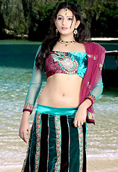 Today’s fashion is really about sensuality which can be seen in this creation. This dark teal blue and deep burgundy velvet lehenga choli is nicely embroidered patch work done with  resham, sequins and lace work. Embroidery work on lehenga is stunning. The beautiful embroidery on lehenga made it awesome and gives you stylish and attractive look to others. Matching choli and dupatta is availble with this lehenga. Slight Color variations are possible due to differing screen and photograph resolutions.
