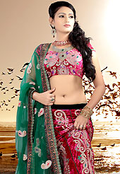 Make your collection more attractive and charming with this impressive dress. This deep pink velvet lehenga choli is nicely embroidered patch work done with  resham, sequins and stone work. Embroidery work on lehenga is stunning. The beautiful embroidery on lehenga made it awesome and gives you stylish and attractive look to others. Matching choli and green net dupatta is availble with this lehenga. Slight Color variations are possible due to differing screen and photograph resolutions.