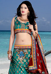 It’s cool and has a very modern look to impress all. This teal green brocade lehenga choli is nicely embroidered patch work done with  resham, sequins and stone work. Embroidery work on lehenga is stunning. The beautiful embroidery on lehenga made it awesome and gives you stylish and attractive look to others. Matching choli and maroon net dupatta is availble with this lehenga. Slight Color variations are possible due to differing screen and photograph resolutions.