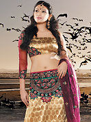 It’s cool and has a very modern look to impress all. This beige and brown brocade lehenga choli is nicely embroidered patch work done with  resham and sequins work in form of floral motifs. Embroidery work on lehenga is stunning. The beautiful embroidery on lehenga made it awesome and gives you stylish and attractive look to others. Matching choli and dark pink net dupatta is availble with this lehenga. Slight Color variations are possible due to differing screen and photograph resolutions.