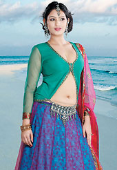 Get ready to sizzle all around you by sparkling lehenga. This blue and dark pink net lehenga choli is nicely embroidered patch work done with  resham, zari, sequins and lace work in form of floral motifs. Embroidery work on lehenga is stunning. The beautiful embroidery on lehenga made it awesome and gives you stylish and attractive look to others. Contrasting turquoise green choli and dark pink net dupatta is availble with this lehenga. Slight Color variations are possible due to differing screen and photograph resolutions.