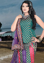 Today’s fashion is really about sensuality which can be seen in this creation. This teal green, purple and dark pink brocade and chiffon lehenga choli is nicely embroidered patch work done with  resham, sequins and lace work. Embroidery work on lehenga is stunning. The beautiful embroidery on lehenga made it awesome and gives you stylish and attractive look to others. Matching choli and purple dupatta is availble with this lehenga. Slight Color variations are possible due to differing screen and photograph resolutions.