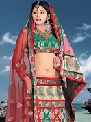 Make your collection more attractive and charming with this impressive dress. This green and red brocade lehenga choli is nicely embroidered patch work done with  resham, sequins and lace work. Embroidery work on lehenga is stunning. The beautiful embroidery on lehenga made it awesome and gives you stylish and attractive look to others. Matching choli and dupatta is availble with this lehenga. Slight Color variations are possible due to differing screen and photograph resolutions.