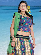 Elegance and innovation of designs crafted for you. This light fawn and purple brocade lehenga choli is nicely embroidered patch work done with  resham, sequins and lace work. Embroidery work on lehenga is stunning. The beautiful embroidery on lehenga made it awesome and gives you stylish and attractive look to others. Matching choli and light green net dupatta is availble with this lehenga. Slight Color variations are possible due to differing screen and photograph resolutions.