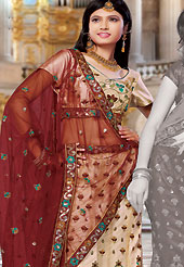 Embroidered lehengas are highly in order on a range of occasions such as wedding, formal party and festivals. This beige net lehenga choli is nicely embroidered and patch work done with resham and sequins work in form of floral motifs. The beautiful embroidery on lehenga made it awesome and gives you stylish and attractive look to others. Matching choli and maroon net dupatta is availble with this lehenga. Slight Color variations are possible due to differing screen and photograph resolutions.