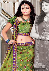 Get ready to sizzle all around you by sparkling lehenga. This olive green net lehenga choli is nicely embroidered and patch work done with resham, zari and sequins work in form of floral motifs. The beautiful embroidery on lehenga made it awesome and gives you stylish and attractive look to others. Matching choli and dupatta is availble with this lehenga. Slight Color variations are possible due to differing screen and photograph resolutions.