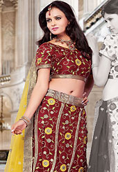 Elegance and innovation of designs crafted for you. This maroon net lehenga choli is nicely embroidered and patch work done with resham, sequins and lace work. The beautiful embroidery on lehenga made it awesome and gives you stylish and attractive look to others. Matching choli and yellow net dupatta is availble with this lehenga. Slight Color variations are possible due to differing screen and photograph resolutions.