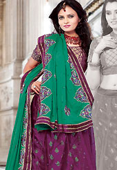 Be the cynosure of all eyes with this wonderful casual wear in flattering colors and combinations. This dark magenta brocade and net lehenga choli is nicely embroidered and patch work done with resham and sequins work. The beautiful embroidery on lehenga made it awesome and gives you stylish and attractive look to others. Matching choli and turquoise green dupatta is availble with this lehenga. Slight Color variations are possible due to differing screen and photograph resolutions.