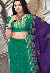 Outfit is a novel ways of getting yourself noticed. This green brocade and net lehenga choli is nicely embroidered and patch work done with resham and sequins work. The beautiful embroidery on lehenga made it awesome and gives you stylish and attractive look to others. Matching choli and purple dupatta is availble with this lehenga. Slight Color variations are possible due to differing screen and photograph resolutions.