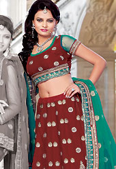 Get ready to sizzle all around you by sparkling lehenga. This red satin lehenga choli is nicely embroidered and patch work done with resham, zari and stone work. The beautiful embroidery on lehenga made it awesome and gives you stylish and attractive look to others. Matching choli and sea green net dupatta is availble with this lehenga. Slight Color variations are possible due to differing screen and photograph resolutions.