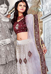 The evolution of style species collection spells pure femininity. This off white net lehenga choli is nicely embroidered and patch work done with resham, sequins and stone work in form of floral motifs. The beautiful embroidery on lehenga made it awesome and gives you stylish and attractive look to others. Contrasting maroon choli and matching net dupatta is availble with this lehenga. Slight Color variations are possible due to differing screen and photograph resolutions.