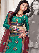 Get ready to sizzle all around you by sparkling lehenga. This turquoise green net lehenga choli is nicely embroidered and patch work done with resham, sequins and lace work in form of floral motifs. The beautiful embroidery on lehenga made it awesome and gives you stylish and attractive look to others. Matching choli and contrasting maroon net dupatta is availble with this lehenga. Slight Color variations are possible due to differing screen and photograph resolutions.