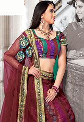 Take a look on the changing fashion of the season. This maroon net and brocade lehenga choli is nicely embroidered and patch work done with resham, sequins and lace work in form of floral motifs. The beautiful embroidery on lehenga made it awesome and gives you stylish and attractive look to others. Matching choli and dupatta is availble with this lehenga. Slight Color variations are possible due to differing screen and photograph resolutions.