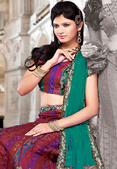 Make your collection more attractive and charming with this impressive dress. This red net and brocade lehenga choli is nicely embroidered and patch work done with resham, stone, sequins and lace work. The beautiful embroidery on lehenga made it awesome and gives you stylish and attractive look to others. Matching choli and contrasting turquoise green net dupatta is availble with this lehenga. Slight Color variations are possible due to differing screen and photograph resolutions.