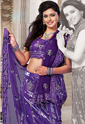 Dreamy variation on shape and forms compliment your style with tradition. This deep purple net and shimmer lehenga choli is nicely embroidered and patch work done with resham, sequins and stone work. The beautiful embroidery on lehenga made it awesome and gives you stylish and attractive look to others. Matching choli and dupatta is availble with this lehenga. Slight Color variations are possible due to differing screen and photograph resolutions.