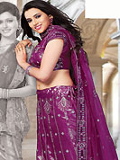 Be the cynosure of all eyes with this wonderful casual wear in flattering colors and combinations. This deep pink net and shimmer lehenga choli is nicely embroidered and patch work done with resham, sequins and stone work. The beautiful embroidery on lehenga made it awesome and gives you stylish and attractive look to others. Matching choli and dupatta is availble with this lehenga. Slight Color variations are possible due to differing screen and photograph resolutions.