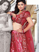 An occasion wear perfect is ready to rock you. This light red net and shimmer lehenga choli is nicely embroidered and patch work done with resham and sequins work. The beautiful embroidery on lehenga made it awesome and gives you stylish and attractive look to others. Matching choli and dupatta is availble with this lehenga. Slight Color variations are possible due to differing screen and photograph resolutions.