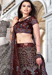 Elegance and innovation of designs crafted for you. This deep brown net lehenga choli is nicely embroidered and patch work done with resham and sequins work. The beautiful embroidery on lehenga made it awesome and gives you stylish and attractive look to others. Matching choli and dupatta is availble with this lehenga. Slight Color variations are possible due to differing screen and photograph resolutions.