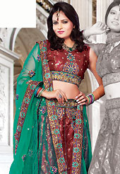 Take a look on the changing fashion of the season. This red brocade and net lehenga choli is nicely embroidered and patch work done with resham and sequins work. The beautiful embroidery on lehenga made it awesome and gives you stylish and attractive look to others. Matching choli and contrasting green net dupatta is availble with this lehenga. Slight Color variations are possible due to differing screen and photograph resolutions.