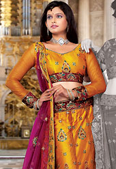 Make your collection more attractive and charming with this impressive dress. This orange net lehenga choli is nicely embroidered and patch work done with resham and sequins work. The beautiful embroidery on lehenga made it awesome and gives you stylish and attractive look to others. Matching choli and contrasting dark magenta net dupatta is availble with this lehenga. Slight Color variations are possible due to differing screen and photograph resolutions.