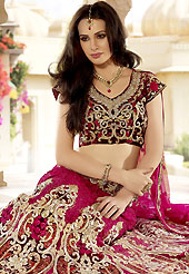 Make your collection more attractive and charming with this impressive dress. This dark pink lehenga choli is nicely embroidered and patch work done with resham, zari, sequins, zardosi and stone work in form of floral motifs. The beautiful embroidery on lehenga made it awesome and gives you stylish and attractive look to others. Contrasting maroon embroidery work choli and matching dupatta is availble with this lehenga. Slight Color variations are possible due to differing screen and photograph resolutions.