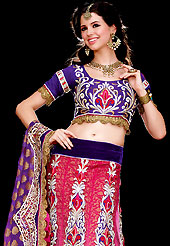 Embroidered lehengas are highly in order on a range of occasions such as wedding, formal party and festivals. This shaded pink and purple net and viscose lehenga choli is nicely embroidered and patch work done with resham, zari, stone and lace work in form of floral motifs. The beautiful embroidery on lehenga made it awesome and gives you stylish and attractive look to others. Matching dark purple embroidery work choli and shaded viscose dupatta is availble with this lehenga. Slight Color variations are possible due to differing screen and photograph resolutions.