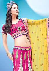 Elegance and innovation of designs crafted for you. This pink art dupion silk lehenga choli is nicely embroidered and velvet patch border is done with resham, zari, beads and stone work. The beautiful embroidery on lehenga made it awesome and gives you stylish and attractive look to others. Matching choli and contrasting yellow net dupatta is availble with this lehenga. Slight Color variations are possible due to differing screen and photograph resolutions.