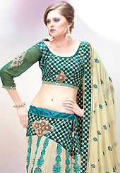 Today’s fashion is really about sensuality which can be seen in this creation. This light fawn and teal green faux georgette lehenga choli is nicely embroidered and velvet patch border is done with resham, zari, stone and sequins work. The beautiful embroidery on lehenga made it awesome and gives you stylish and attractive look to others. Matching choli and double dye dupatta is availble with this lehenga. Slight Color variations are possible due to differing screen and photograph resolutions.