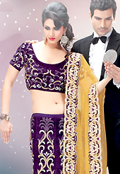Make your collection more attractive and charming with this impressive dress. This dark purple velvet lehenga choli is nicely embroidered and velvet patch border is done with resham, zari, stone and sequins work. The beautiful embroidery on lehenga made it awesome and gives you stylish and attractive look to others. Matching choli and yellow net dupatta is availble with this lehenga. Slight Color variations are possible due to differing screen and photograph resolutions.