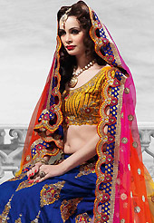 Welcome to the new era of Indian fashion wear. This blue raw silk lehenga is nicely embroidered patch work is done with resham, zari, sequins, stone and kundan work. The beautiful embroidery on lehenga made it awesome and gives you stylish and attractive look to others. Contrasting mustard choli and shaded pink, yellow and orange net dupatta is availble with this lehenga. Slight Color variations are possible due to differing screen and photograph resolutions.