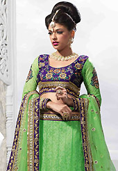 No one like ordinary look, because every woman has their own beauty and our collection gives extra ordinary look to you. This light green net lehenga is nicely embroidered patch work is done with resham, zari, sequins, stone and lace work. The beautiful embroidery on lehenga made it awesome and gives you stylish and attractive look to others. Contrasting purple art silk choli and matching net dupatta is availble with this lehenga. Slight Color variations are possible due to differing screen and photograph resolutions.