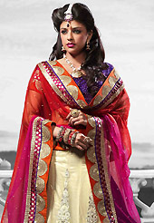 Let your personality speak for you this wedding lehenga embellished with embroidery work. This cream net lehenga is nicely embroidered patch work is done with resham, zari, sequins, stone and lace work. The beautiful embroidery on lehenga made it awesome and gives you stylish and attractive look to others. Contrasting purple choli and shaded red and pink net dupatta is availble with this lehenga. Slight Color variations are possible due to differing screen and photograph resolutions.
