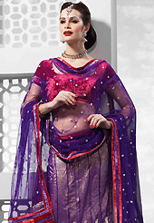 The evolution of style species collection spells pure femininity. This purple net lehenga is nicely embroidered and velvet patch on border work is done with resham, zari, sequins and stone work. The beautiful embroidery on lehenga made it awesome and gives you stylish and attractive look to others. Contrasting red velvet choli and dark purple net dupatta is availble with this lehenga. Slight Color variations are possible due to differing screen and photograph resolutions.
