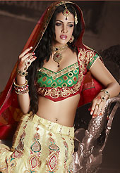 Embroidered lehengas are highly in order on a range of occasions such as wedding, formal party and festivals. This cream net lehenga is nicely embroidered patch work is done with resham, zari, sequins, stone, beads and lace work. The beautiful embroidery on lehenga made it awesome and gives you stylish and attractive look to others. Contrasting red and green choli and red net dupatta is availble with this lehenga. Slight Color variations are possible due to differing screen and photograph resolutions.