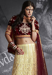 Make your collection more attractive and charming with this impressive dress. This cream net lehenga is nicely embroidered patch work is done with resham, zari, sequins, stone and lace work. The beautiful embroidery on lehenga made it awesome and gives you stylish and attractive look to others. Contrasting maroon choli and maroon net dupatta is availble with this lehenga. Slight Color variations are possible due to differing screen and photograph resolutions.