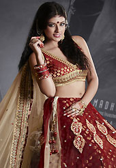 Elegance and innovation of designs crafted for you. This dark red net lehenga is nicely embroidered patch work is done with resham, zari, sequins, stone, pearls and lace work. The beautiful embroidery on lehenga made it awesome and gives you stylish and attractive look to others. Matching dark red choli and fawn net dupatta is availble with this lehenga. Slight Color variations are possible due to differing screen and photograph resolutions.