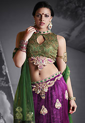 Dreamy variation on shape and forms compliment your style with tradition. This dark purple net lehenga is nicely embroidered patch work is done with resham, zari, sequins, stone, pearls and lace work. The beautiful embroidery on lehenga made it awesome and gives you stylish and attractive look to others. Contrasting green choli and green net dupatta is availble with this lehenga. Slight Color variations are possible due to differing screen and photograph resolutions.