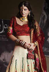 Be the cynosure of all eyes with this wonderful casual wear in flattering colors and combinations. This shaded cream georgette lehenga is nicely embroidered patch work is done with resham, zari, sequins, stone and lace work. The beautiful embroidery on lehenga made it awesome and gives you stylish and attractive look to others. Contrasting dark red choli and dark red net dupatta is availble with this lehenga. Slight Color variations are possible due to differing screen and photograph resolutions.