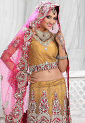 Get ready to sizzle all around you by sparkling lehenga. This light brown net lehenga is nicely embroidered and velvet patch work is done with stone, zardosi, cutdana and cutbeads work. The beautiful embroidery on lehenga made it awesome and gives you stylish and attractive look to others. Matching choli and pink net dupatta is availble with this lehenga. Slight Color variations are possible due to differing screen and photograph resolutions.