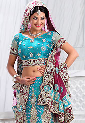 Take a look on the changing fashion of the season. This sky blue net lehenga is nicely embroidered patch work is done with stone, zardosi, cutdana and cutbeads work. The beautiful embroidery on lehenga made it awesome and gives you stylish and attractive look to others. Matching choli and dark pink net dupatta is availble with this lehenga. Slight Color variations are possible due to differing screen and photograph resolutions.
