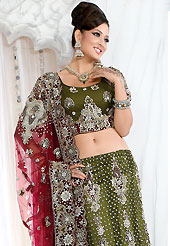 Bold colors created by the inventive drapes of textile catch the imagination like no other contemporary clothing. This olive green net lehenga is nicely embroidered and velvet patch work is done with stone, zardosi, cutdana and cutbeads work. The beautiful embroidery on lehenga made it awesome and gives you stylish and attractive look to others. Matching choli and red net dupatta is availble with this lehenga. Slight Color variations are possible due to differing screen and photograph resolutions.