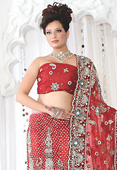 Make your collection more attractive and charming with this impressive dress. This red net lehenga is nicely embroidered and velvet patch work is done with stone, zardosi, cutdana and cutbeads work. The beautiful embroidery on lehenga made it awesome and gives you stylish and attractive look to others. Matching choli and dupatta is availble with this lehenga. Slight Color variations are possible due to differing screen and photograph resolutions.