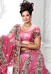 Dreamy variation on shape and forms compliment your style with tradition. This pink net lehenga is nicely embroidered and velvet patch work is done with stone, zardosi, cutdana and cutbeads work. The beautiful embroidery on lehenga made it awesome and gives you stylish and attractive look to others. Matching choli and dupatta is availble with this lehenga. Slight Color variations are possible due to differing screen and photograph resolutions.