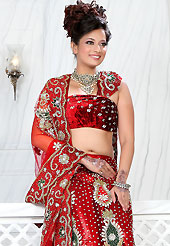 Today’s fashion is really about sensuality which can be seen in this creation. This red net lehenga is nicely embroidered and velvet patch work is done with stone, zardosi, cutdana and cutbeads work. The beautiful embroidery on lehenga made it awesome and gives you stylish and attractive look to others. Matching choli and dupatta is availble with this lehenga. Slight Color variations are possible due to differing screen and photograph resolutions.