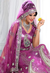 Embroidered lehengas are highly in order on a range of occasions such as wedding, formal party and festivals. This fushsia pink net lehenga is nicely embroidered patch work is done with stone, zardosi, cutdana and cutbeads work. The beautiful embroidery on lehenga made it awesome and gives you stylish and attractive look to others. Matching choli and dupatta is availble with this lehenga. Slight Color variations are possible due to differing screen and photograph resolutions.