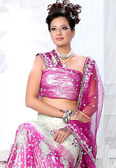Take a look on the changing fashion of the season. This off white and pink net lehenga is nicely embroidered patch work is done with stone, zardosi, cutdana and cutbeads work. The beautiful embroidery on lehenga made it awesome and gives you stylish and attractive look to others. Matching choli and dupatta is availble with this lehenga. Slight Color variations are possible due to differing screen and photograph resolutions.