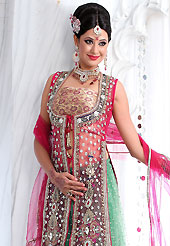 Make your collection more attractive and charming with this impressive dress. This light pastel green net lehenga is nicely embroidered patch work is done with stone, zardosi, cutdana and cutbeads work. The beautiful embroidery on lehenga made it awesome and gives you stylish and attractive look to others. Contrasting beige choli, heavy work dark pink net jacket and dark pink net dupatta is availble with this lehenga. Slight Color variations are possible due to differing screen and photograph resolutions.