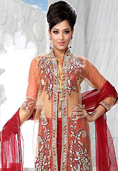 An occasion wear perfect is ready to rock you. This red net lehenga is nicely embroidered patch work is done with stone, zardosi, cutdana and cutbeads work. The beautiful embroidery on lehenga made it awesome and gives you stylish and attractive look to others. Matching choli, heavy work peach net jacket and red net dupatta is availble with this lehenga. Slight Color variations are possible due to differing screen and photograph resolutions.